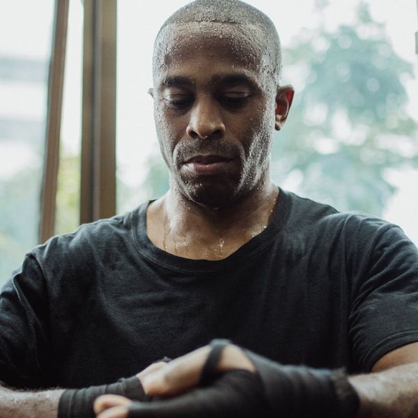 Man concentrating before a workout, showing mental focus and preparation.